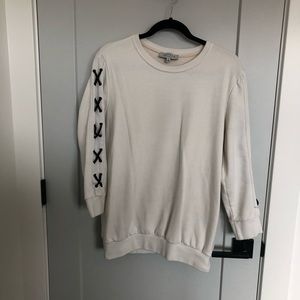 White pullover with accent detail on sleeve